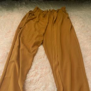 Burnt orange flowy dress pants.